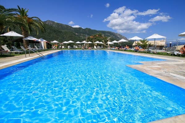 Seasonal outdoor pool, open 9:00 AM to 8:00 PM, free pool cabanas
