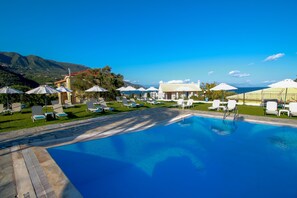 Seasonal outdoor pool, open 9:00 AM to 8:00 PM, free pool cabanas