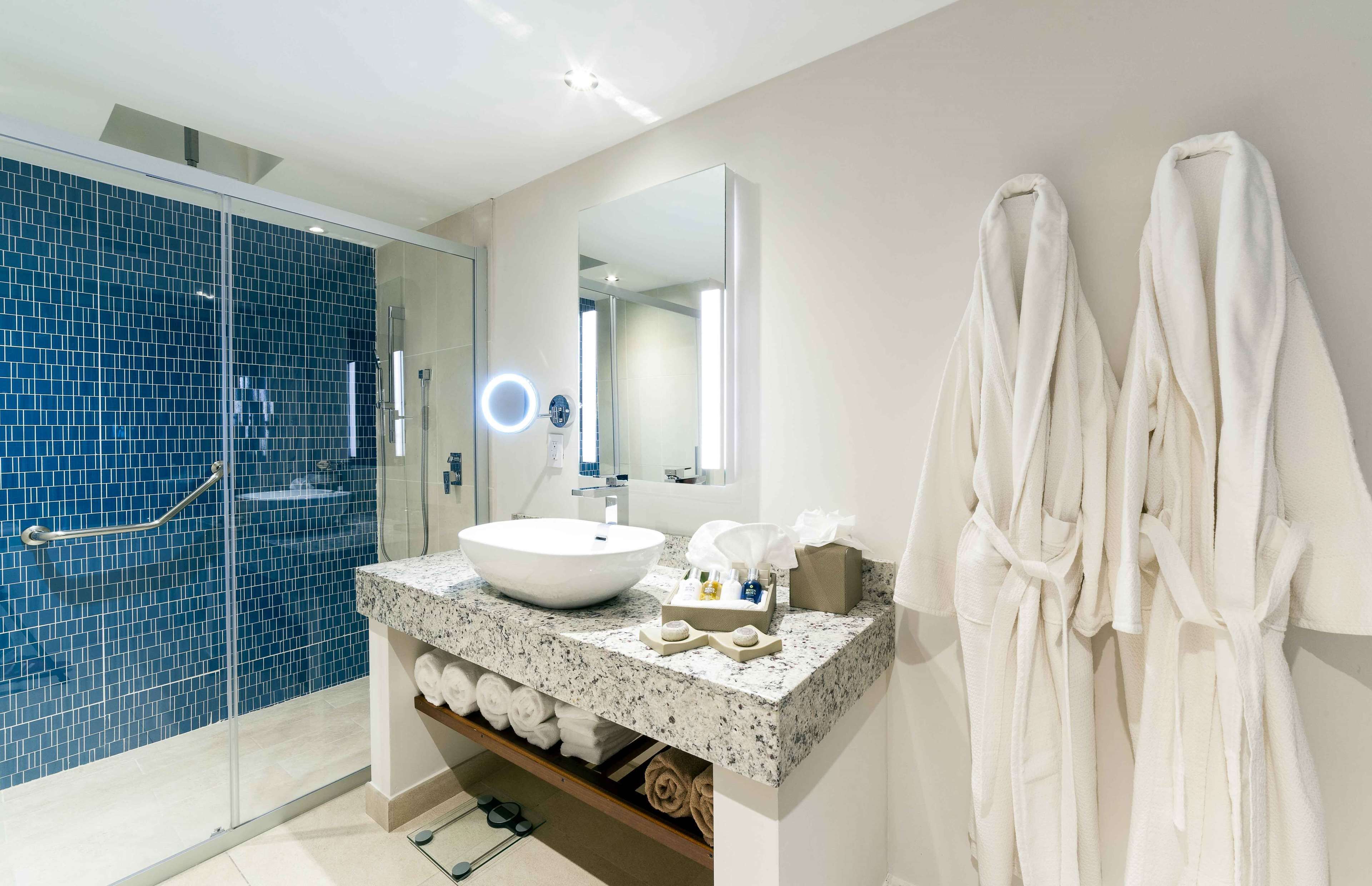 Suite, 1 King Bed, Ocean View (Deluxe One Bedroom Suite) | Bathroom | Designer toiletries, hair dryer, bathrobes, slippers