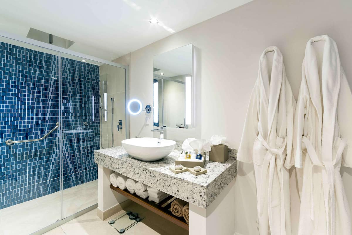 Suite, 1 King Bed, Ocean View (Deluxe One Bedroom Suite) | Bathroom | Designer toiletries, hair dryer, bathrobes, slippers