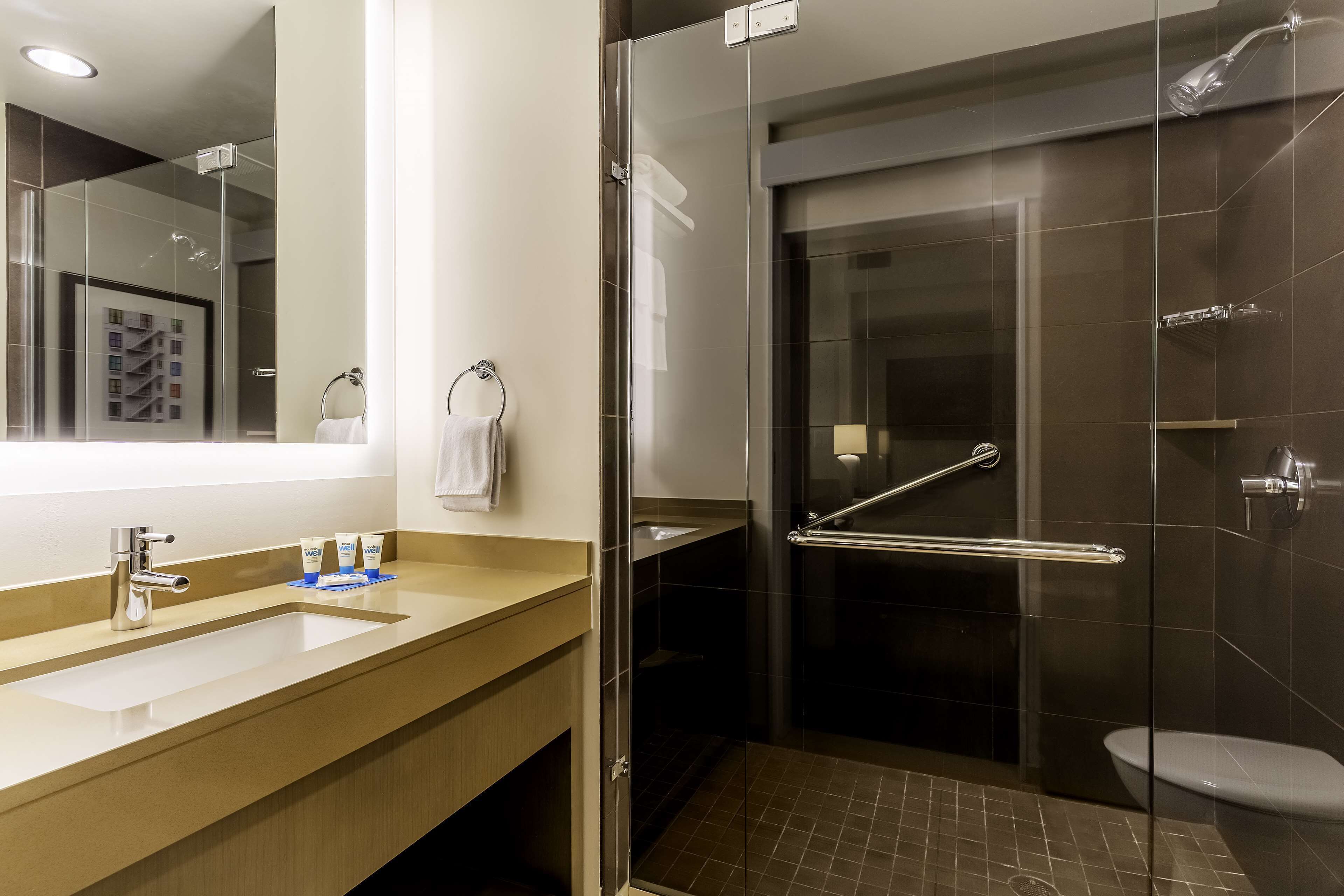 room, 1 king bed (den) | bathroom | designer toiletries, hair dryer, towels, soap