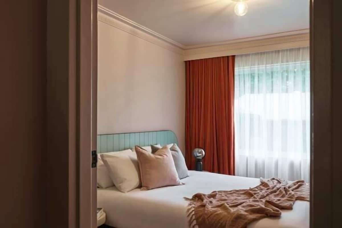 Premium bedding, blackout drapes, iron/ironing board, free WiFi