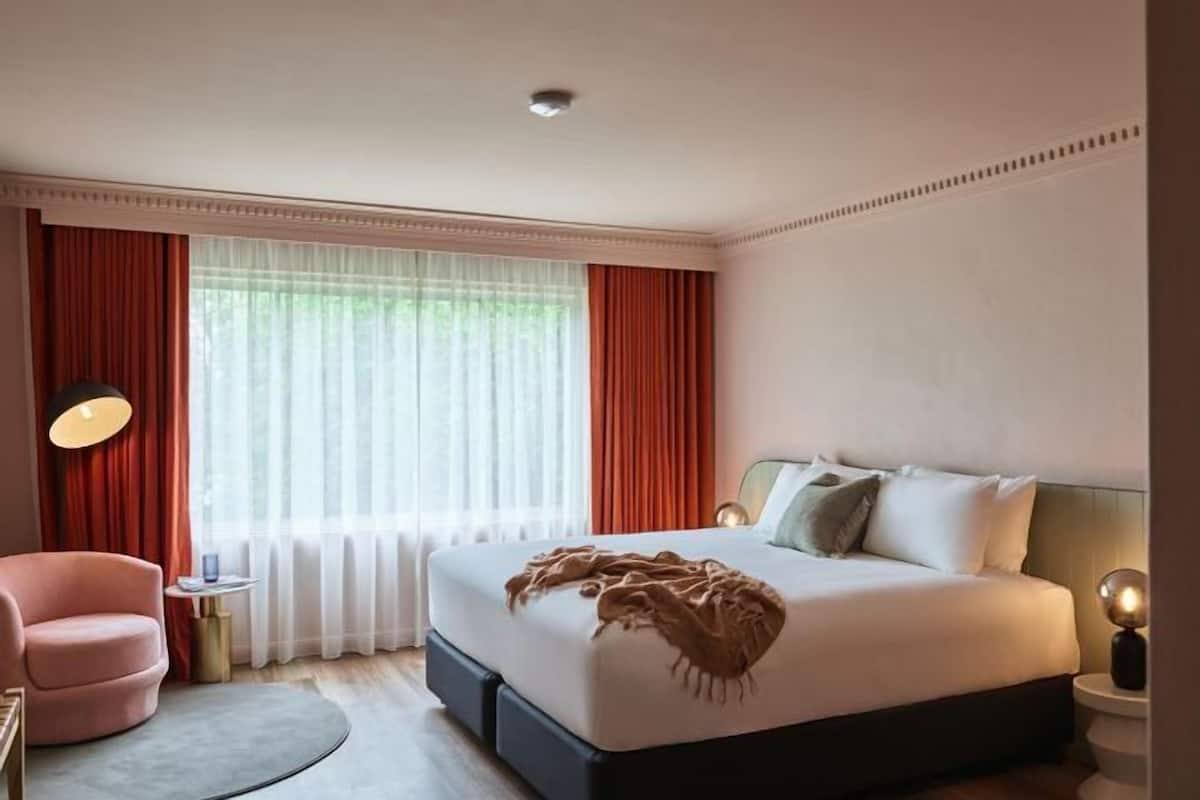Premium bedding, blackout drapes, iron/ironing board, free WiFi