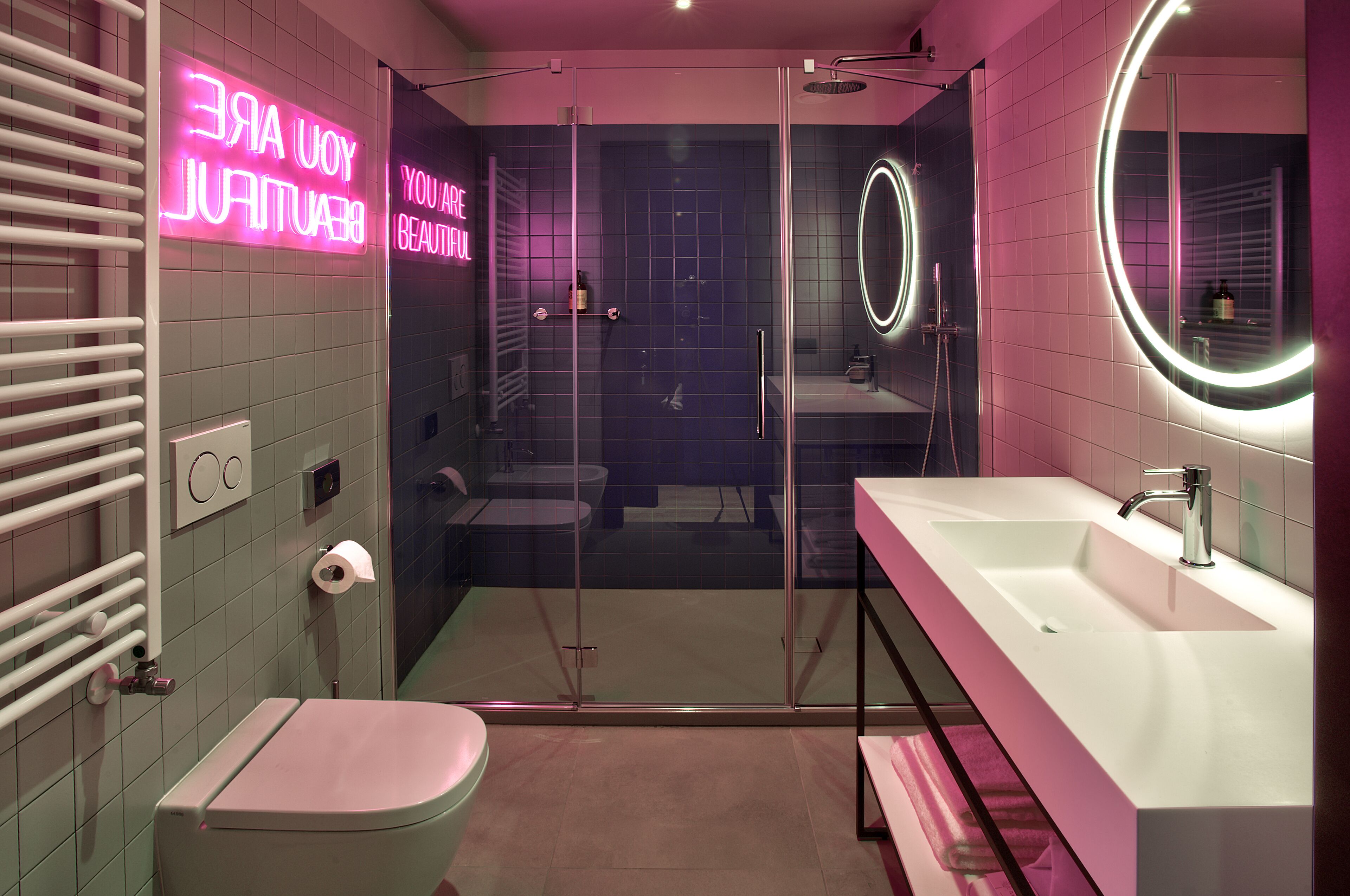 deluxe room | bathroom | shower, rainfall showerhead, free toiletries, hair dryer