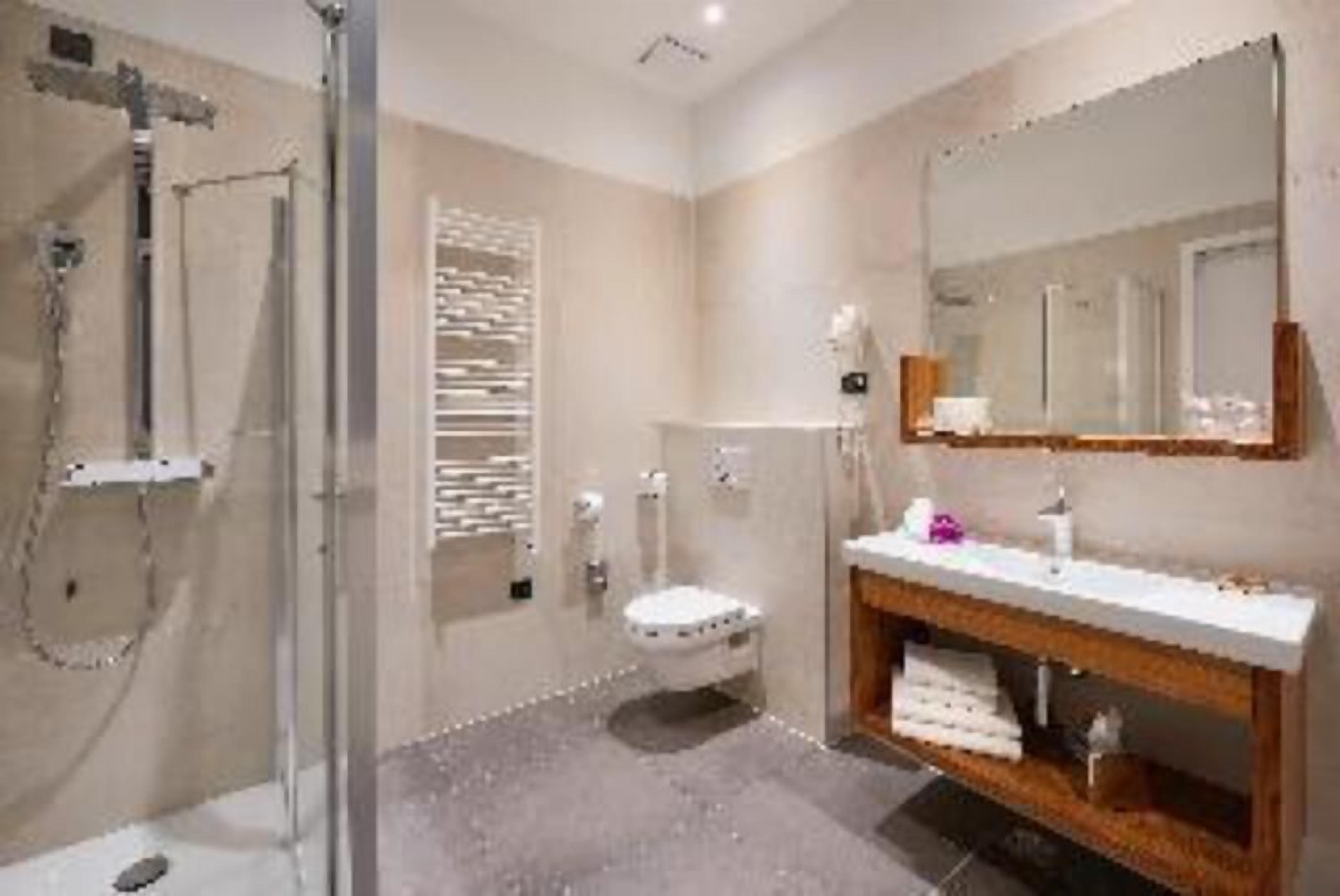 Bathroom | Rainfall showerhead, designer toiletries, hair dryer, towels