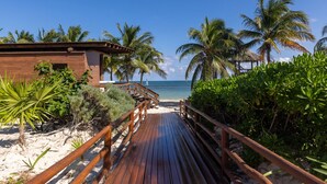 A wooden boardwalk leading to a beach with palm trees and a clear blue sky. - Royalton Hideaway Riviera Cancun, An Autograph Collection All-Inclusive Resort- Adults Only - Newly Renovated (Puerto Morelos)