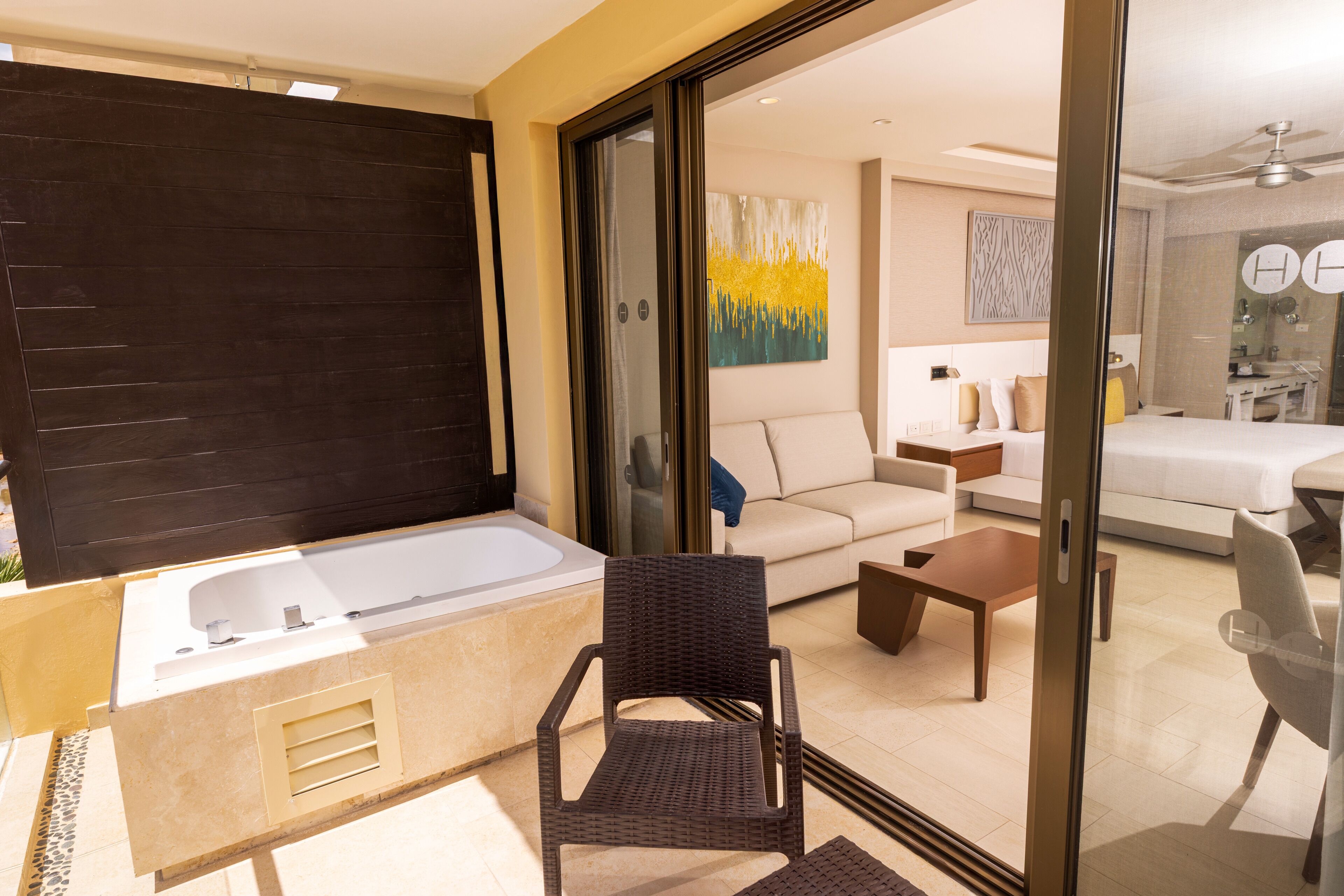 A modern bathroom with a bathtub, a shower, and a glass-enclosed shower area.