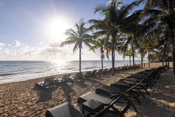Beach nearby, white sand, sun loungers, beach umbrellas