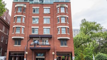 Stylish building with a modern design, featuring a flat roof and multiple windows.