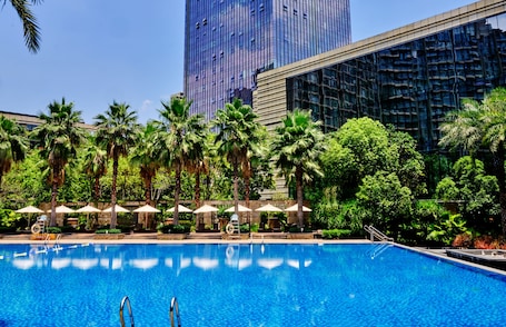 Indoor pool, outdoor pool, open 6:00 AM to 10:00 PM, pool umbrellas