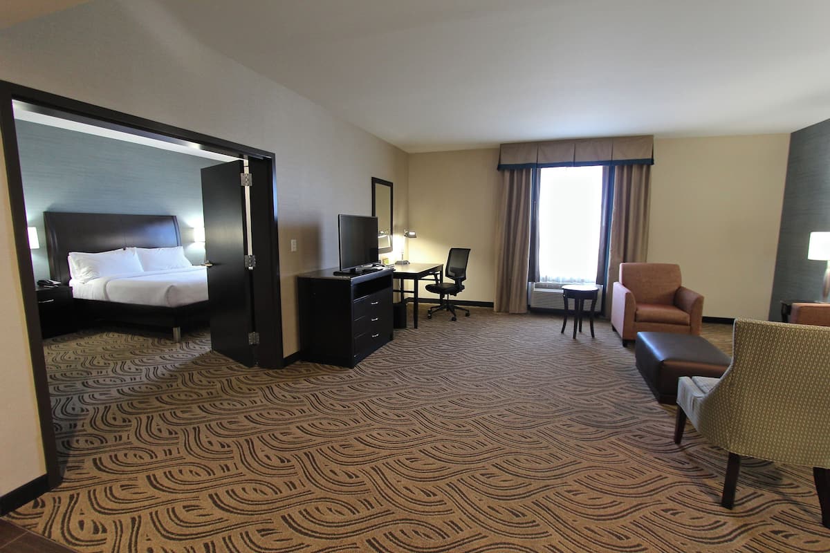 Premium bedding, desk, laptop workspace, blackout drapes