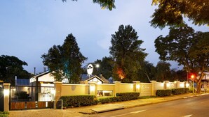 A hotel entrance with a sign for 'Cico Hotel Restaurant Conference'.