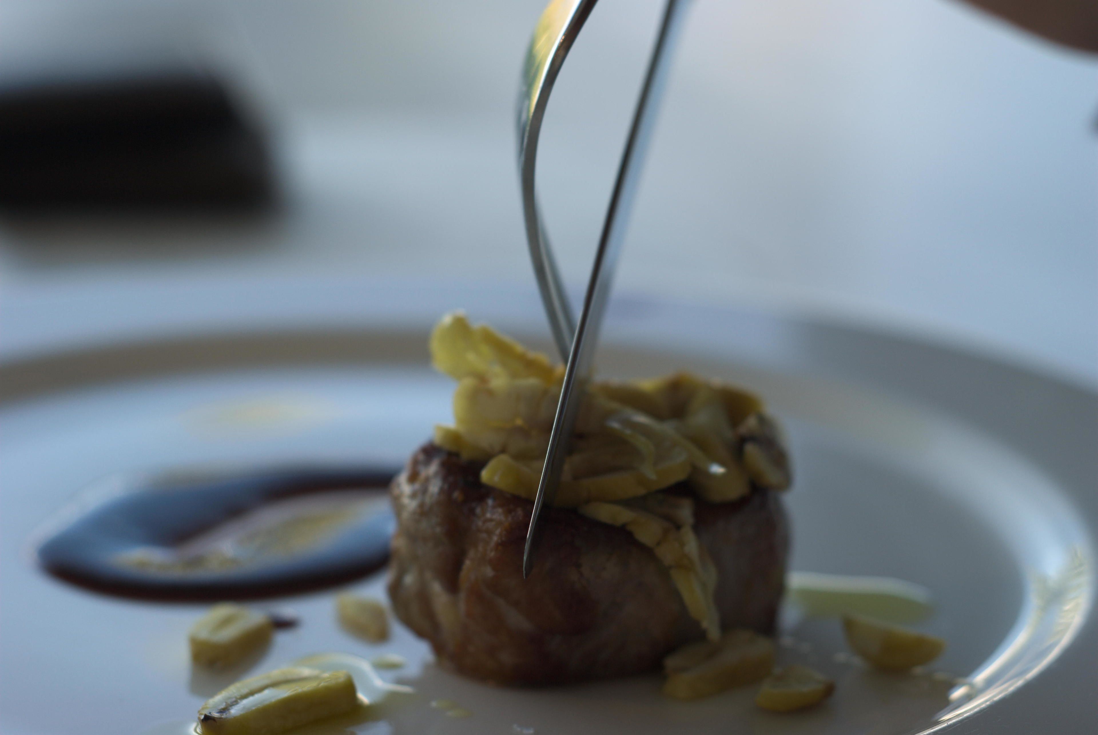 A dessert on a plate with a knife.
