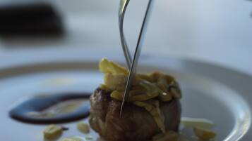 A dessert on a plate with a knife.