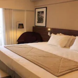 Habitación Deluxe | Minibar, caja fuerte, escritorio y sistema de insonorización