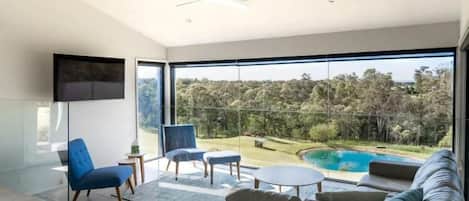 Deluxe House | Living area | LCD TV, fireplace