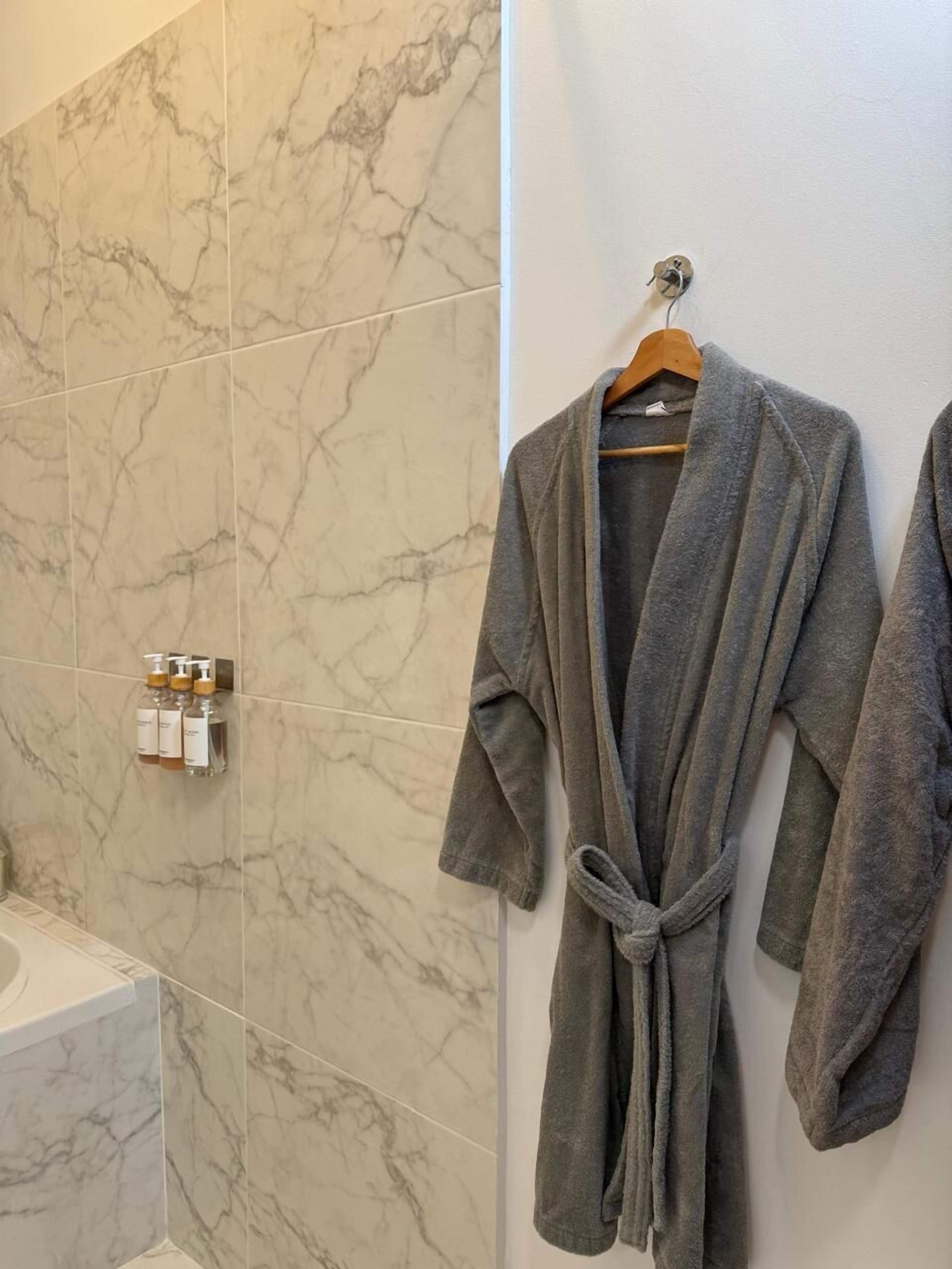 presidential suite | bathroom amenities | shower, rainfall showerhead, hair dryer, towels
