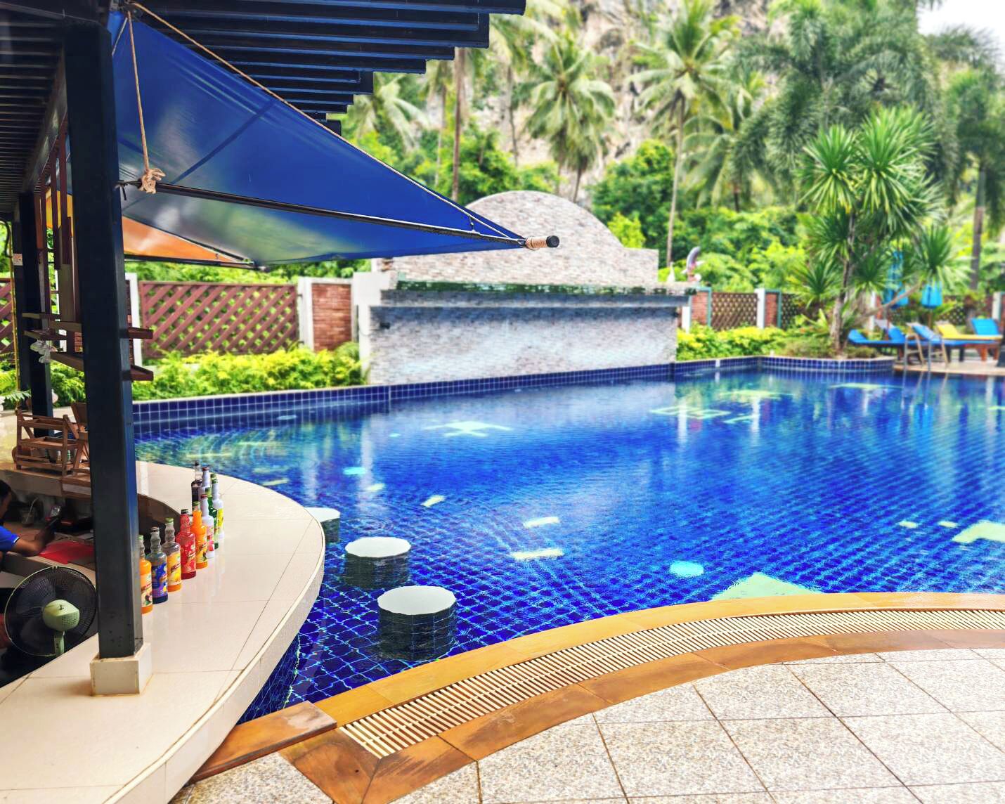 outdoor pool, open 9:00 am to 8:00 pm, pool umbrellas, pool loungers