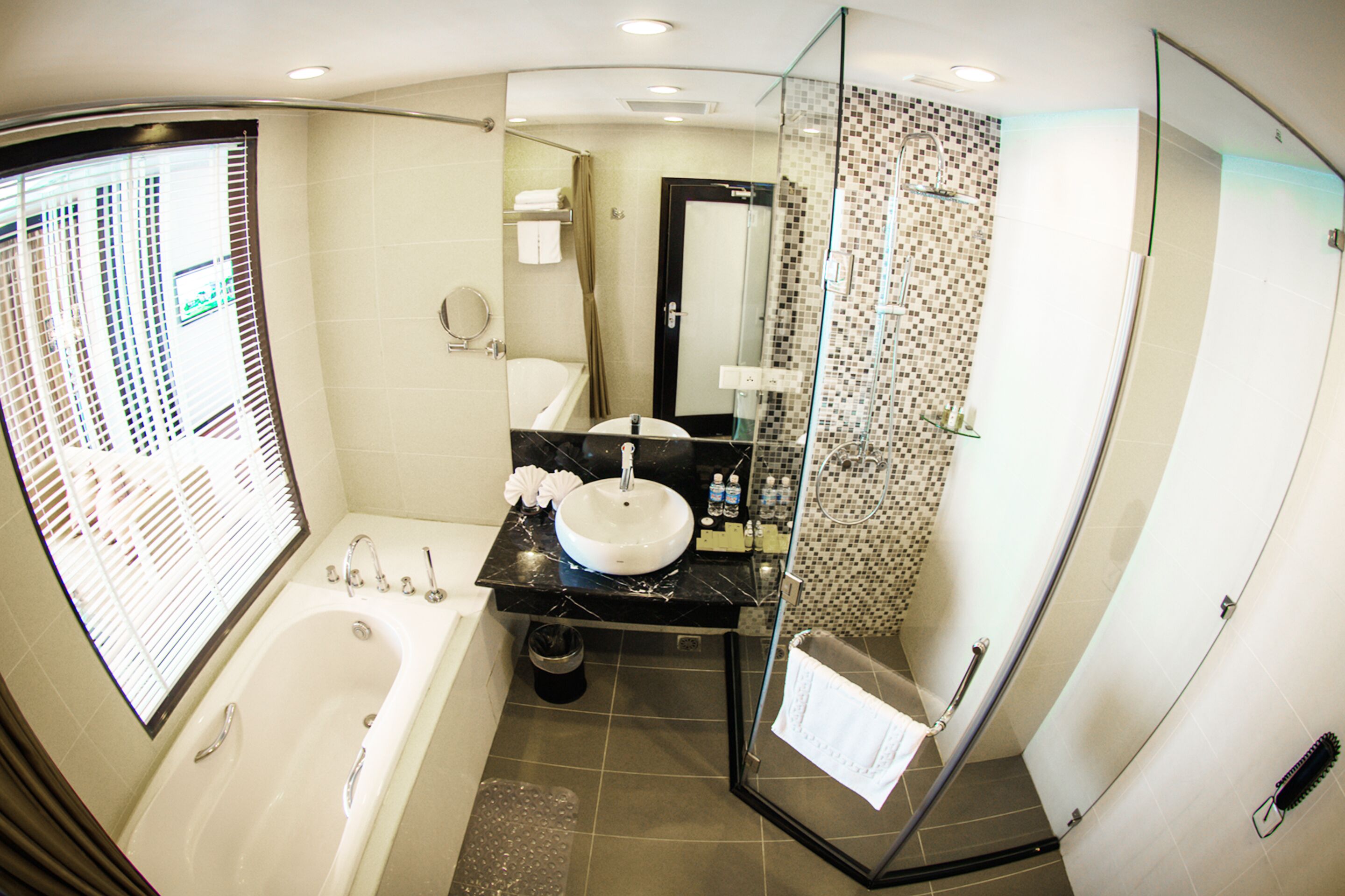 suite | bathroom | combined shower/bathtub, designer toiletries, hair dryer, bathrobes