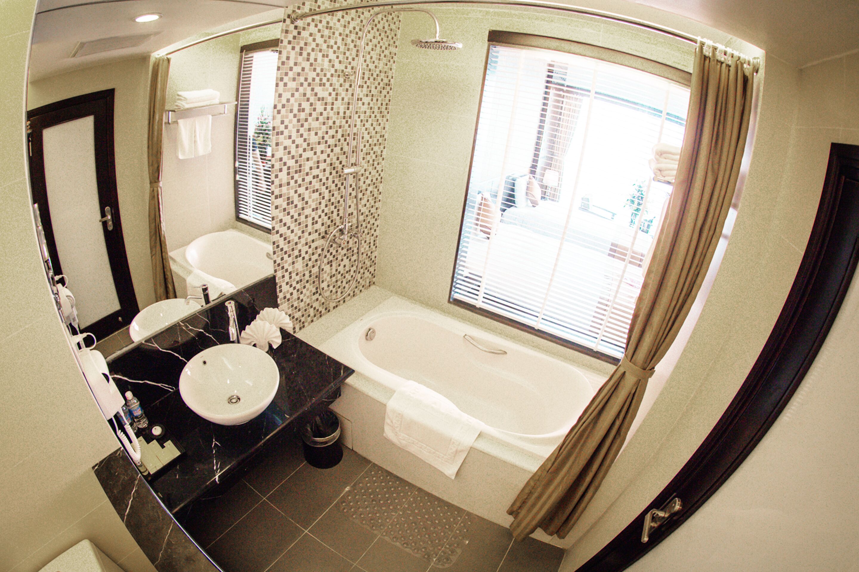 premium room | bathroom | combined shower/bathtub, designer toiletries, hair dryer, bathrobes