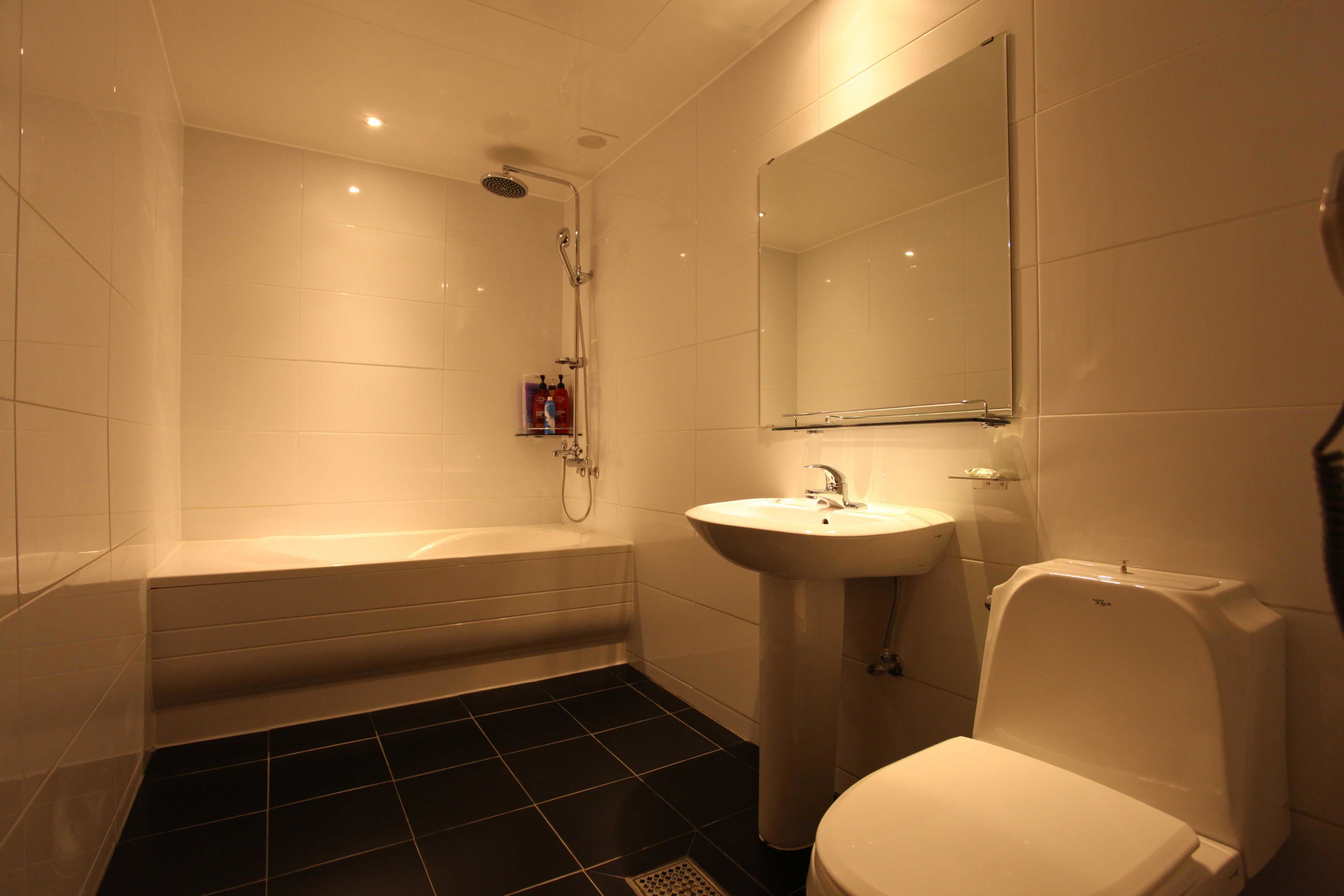 Shower, hair dryer, slippers, towels