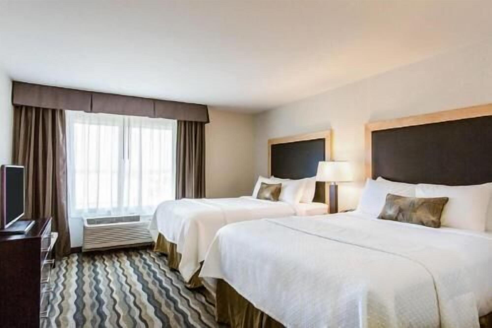 Premium bedding, Tempur-Pedic beds, individually furnished, desk