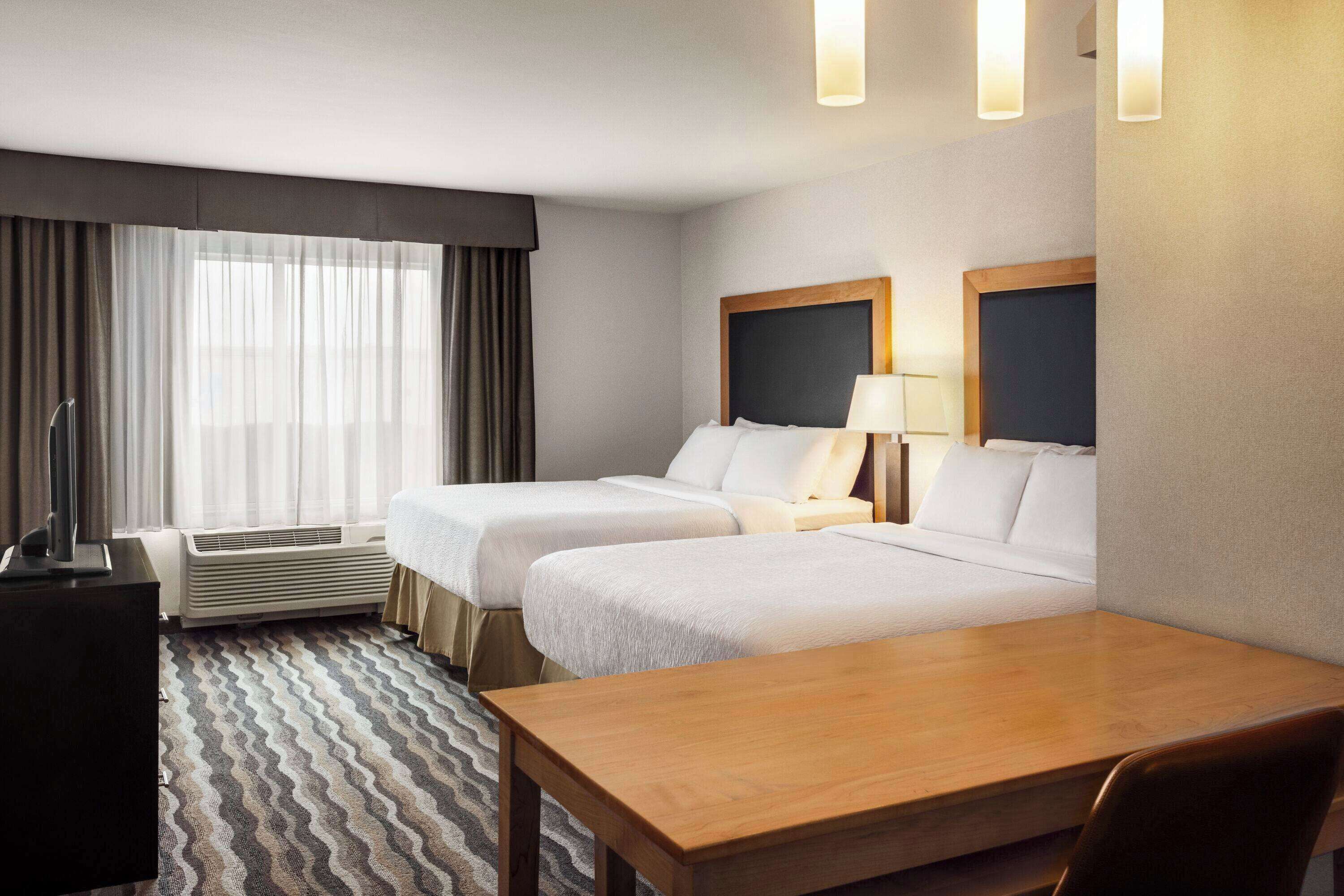 premium bedding, tempur-pedic beds, individually furnished, desk