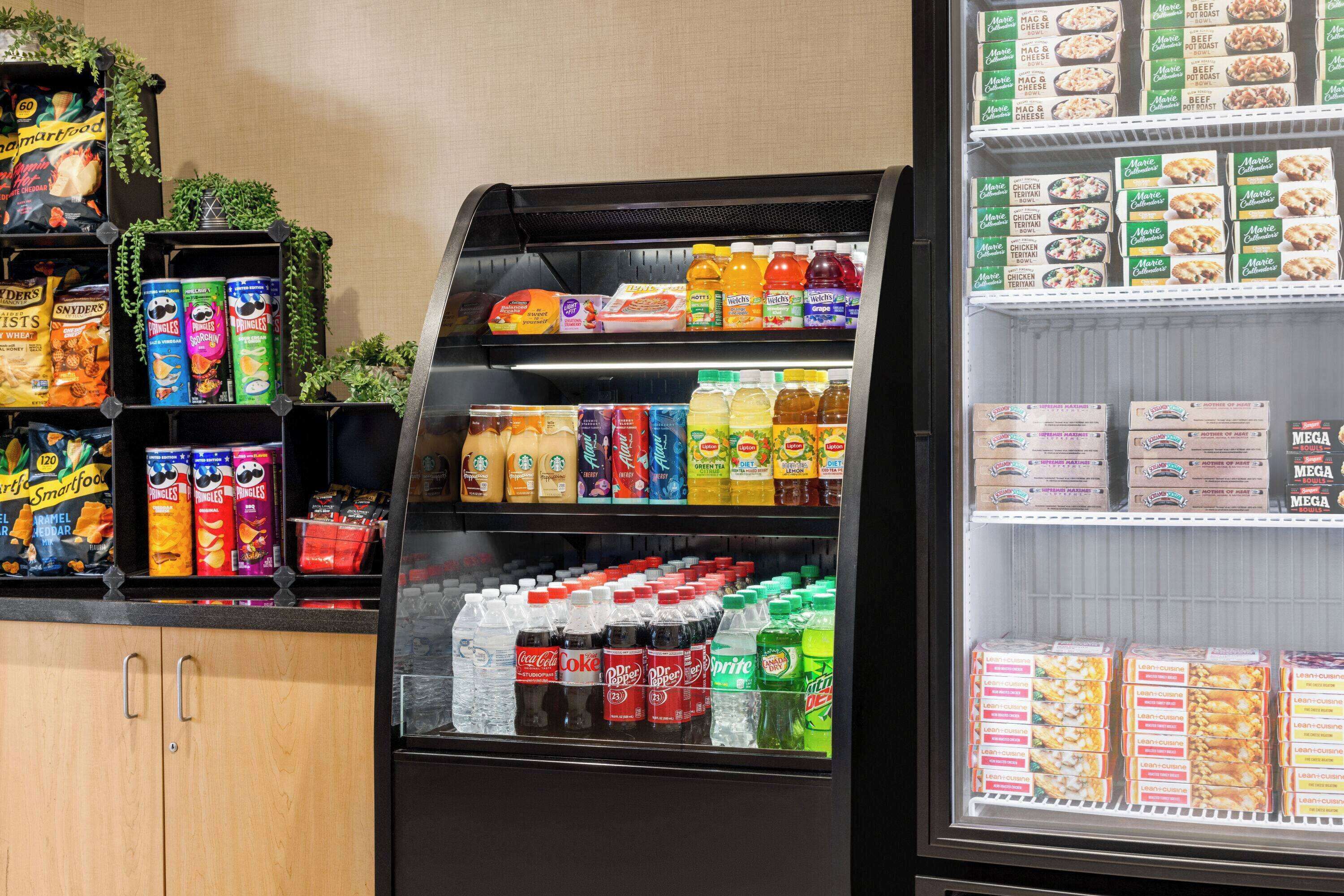 A vending machine with snacks, drinks, and boxed meals.