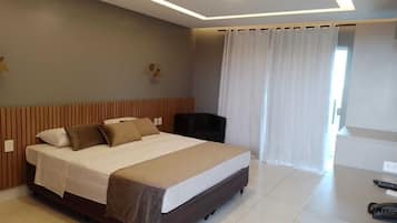 Deluxe Room, Balcony | Minibar, individually furnished, desk, laptop workspace