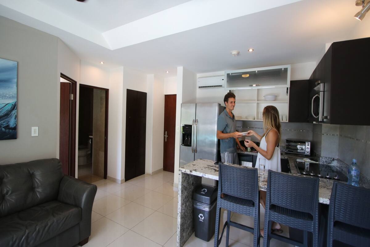 1br kitchen suite w/kitchen, living room, 2 balconies | private kitchen | coffee/tea maker, high chair, eco-friendly cleaning products