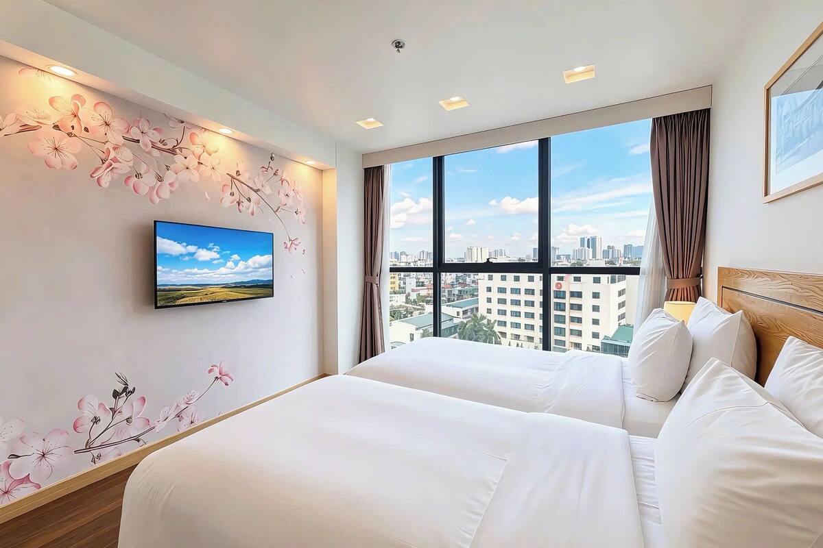 Habitación ejecutiva con 2 camas individuales, tina, vista a la ciudad | Vista desde la habitación