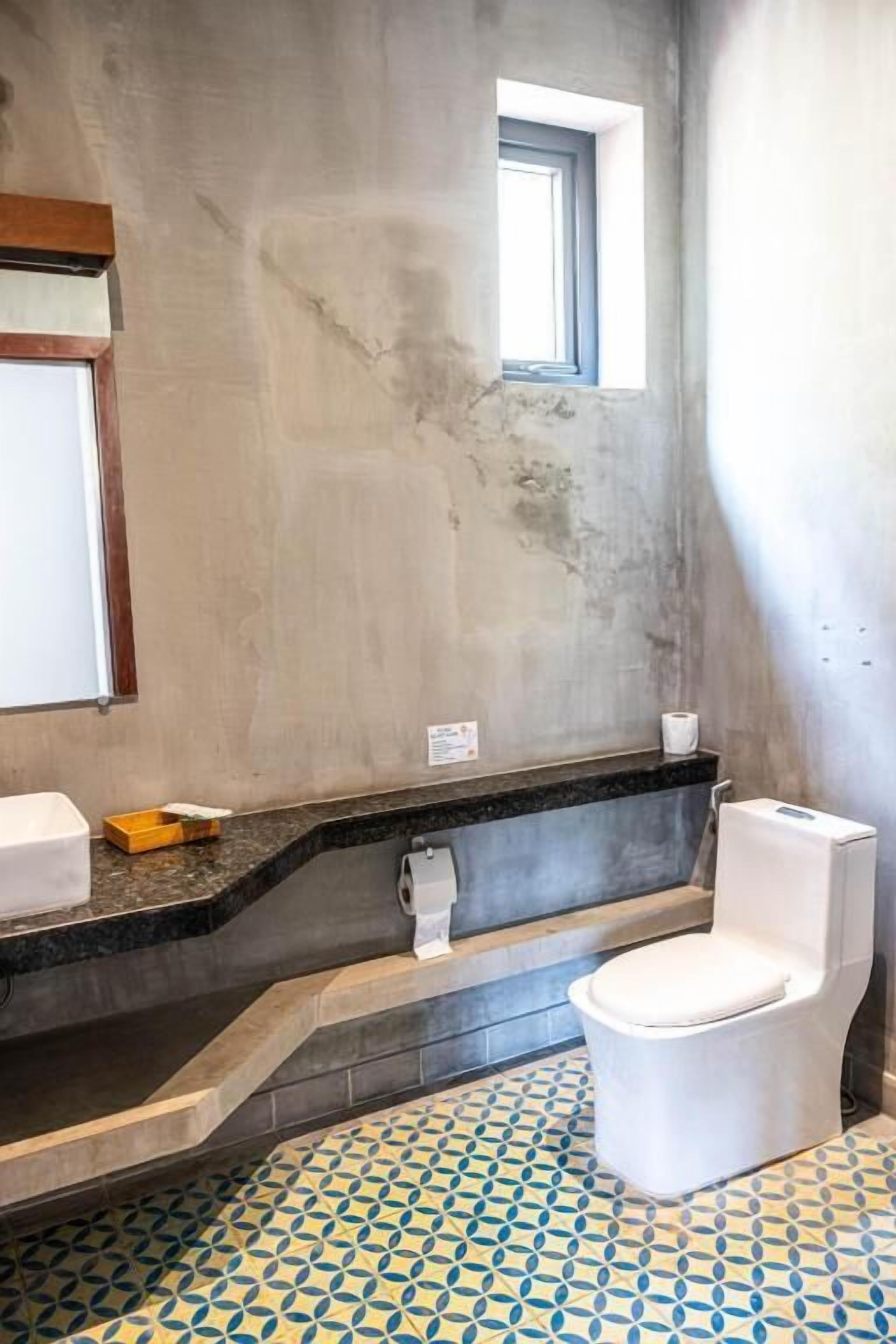 luxury studio suite, 1 king bed | bathroom | shower, hair dryer, slippers, towels