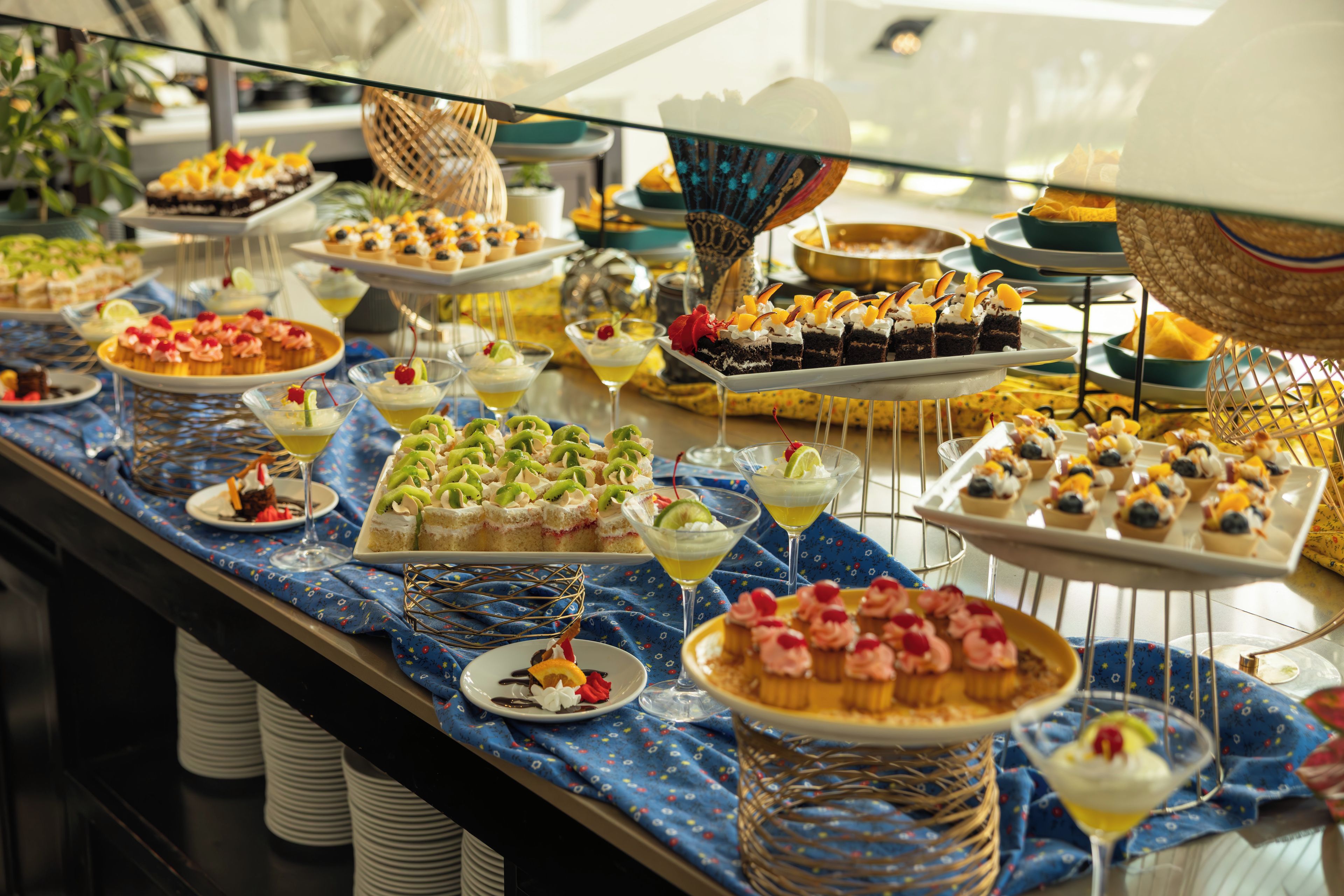 A buffet with various desserts and beverages.