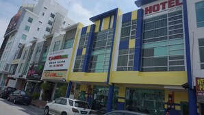 A hotel with a modern facade, large windows, and a prominent sign. - Sun Inns Hotel Laksamana (Malacca City)