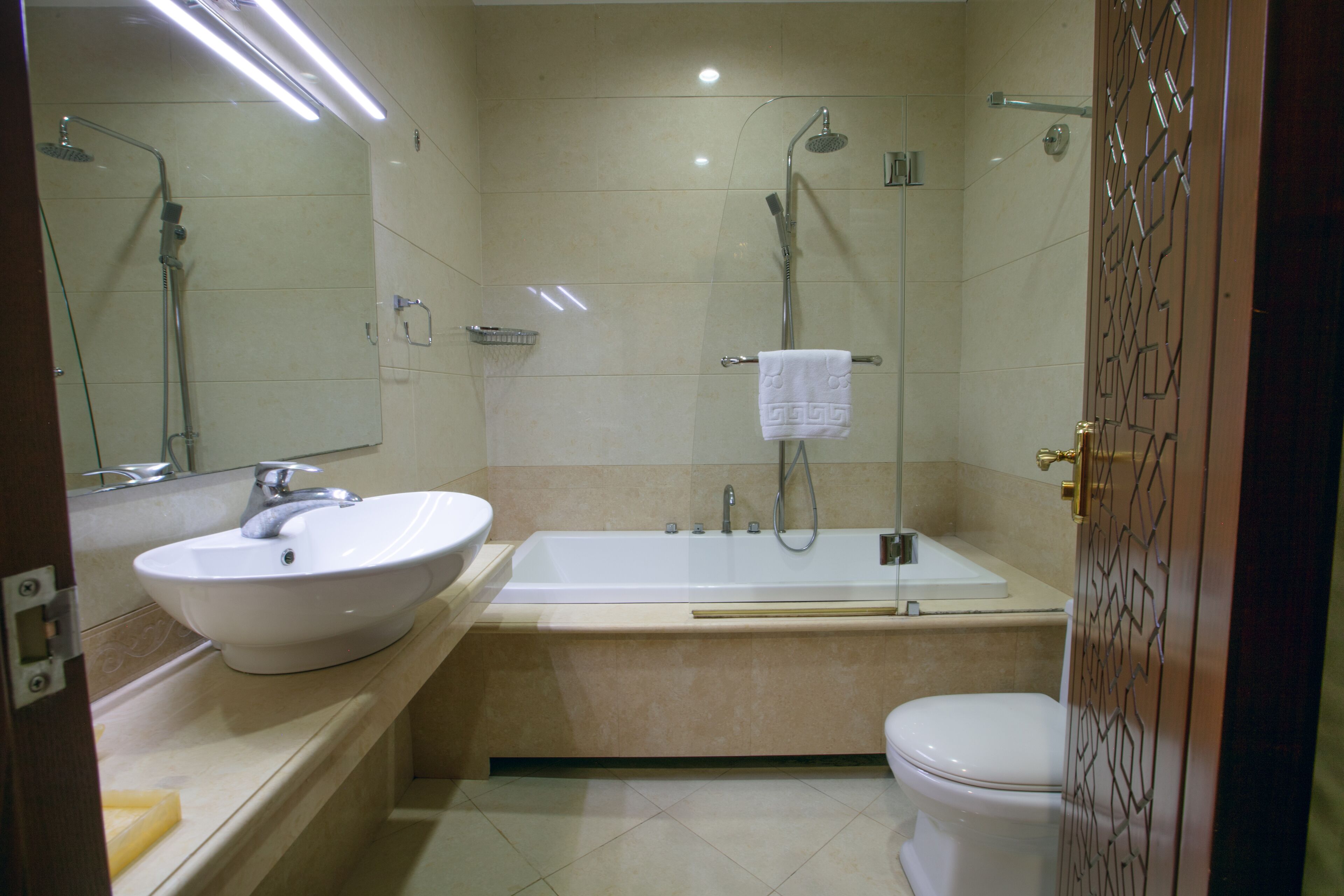 A bathroom with a sink, bathtub, and toilet.