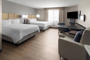 A hotel room with two beds, a desk, a chair, a flat-screen TV, and a window with curtains. - Candlewood Suites Fort Campbell - Oak Grove by IHG (Oak Grove)