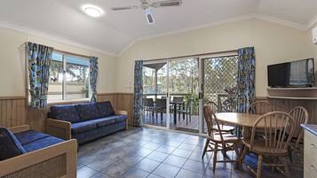 Standard Cabin, 2 Bedrooms (Sleeps 5) | Living area | Flat-screen TV
