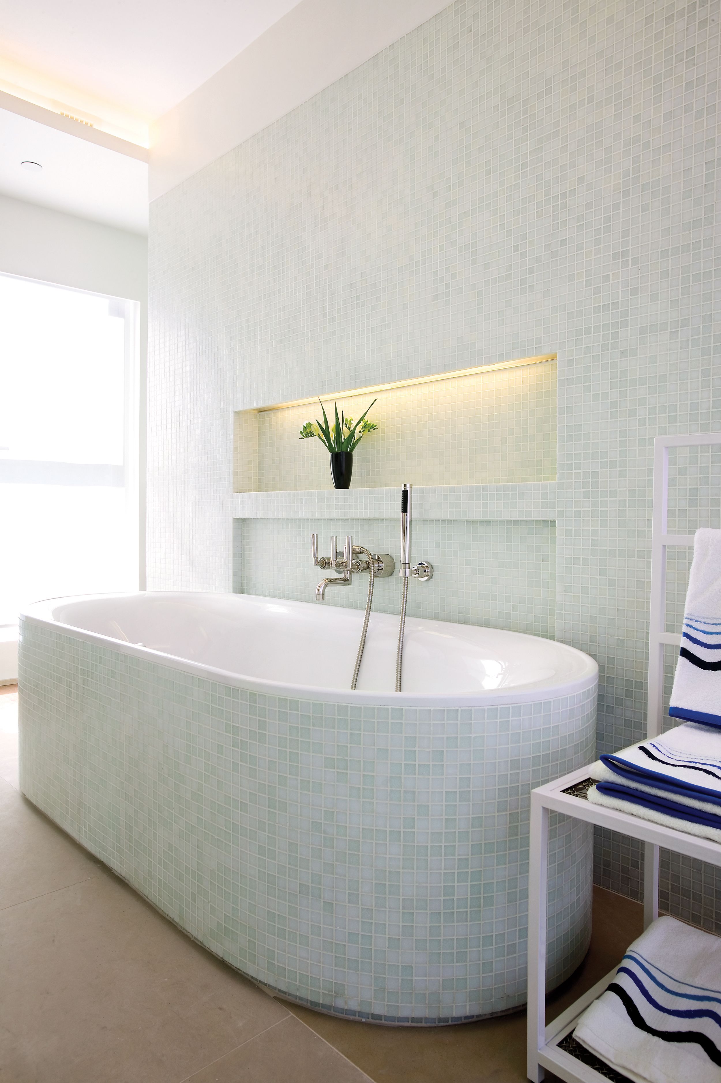 designer toiletries, hair dryer, slippers, towels