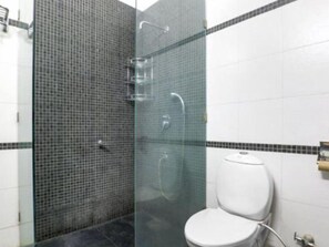 Deep-soaking bathtub, rainfall showerhead, free toiletries, hair dryer