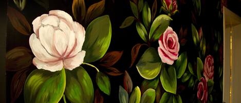 A wall with a floral mural.