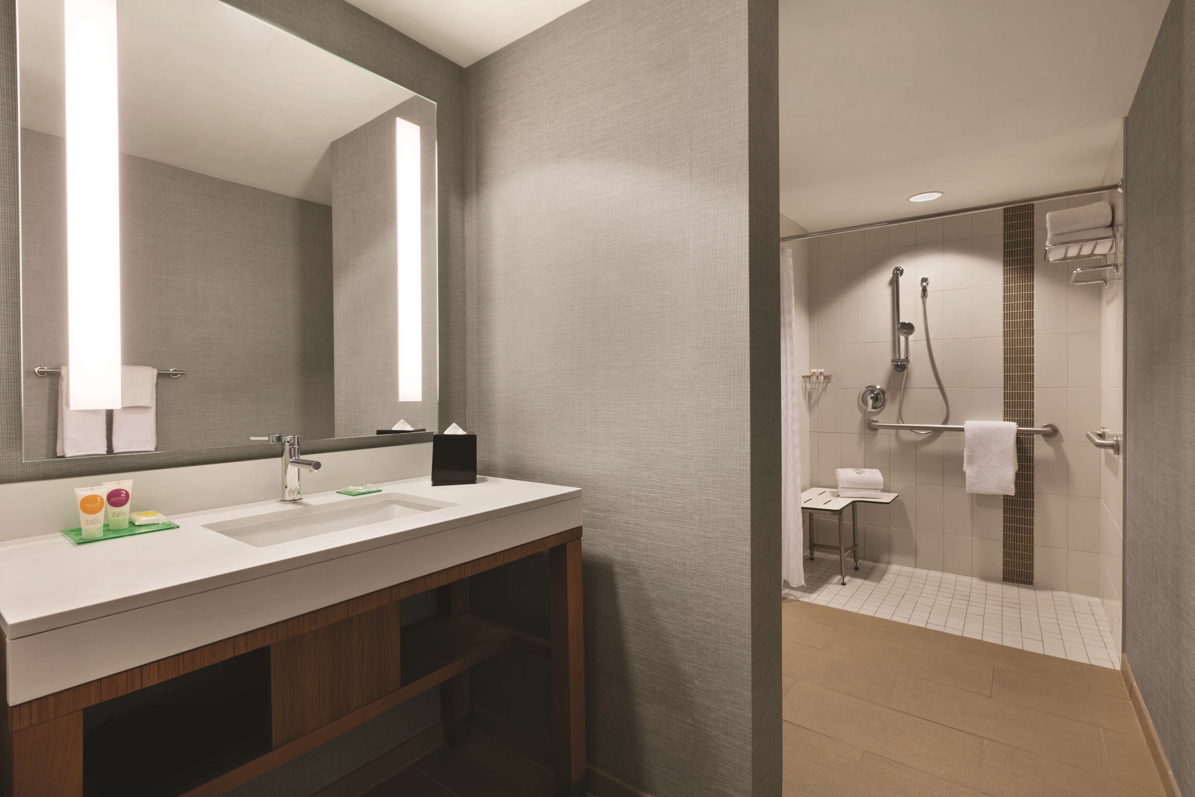 designer toiletries, hair dryer, towels