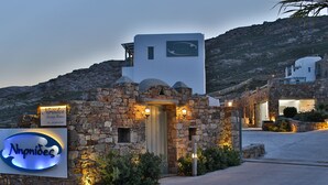 A stone building with a sign for 'Noprides Luxury Homes'. - Niriides Homes & Villas (Mykonos)