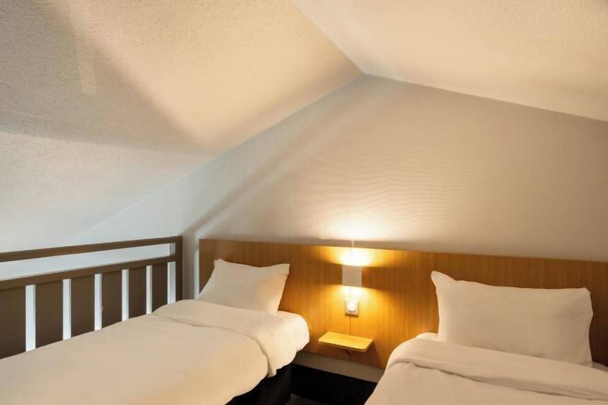 Premium bedding, desk, laptop workspace, blackout curtains