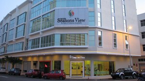 A multi-story hotel with a modern facade, large windows, and a prominent Seasons View sign. - Seasons View Hotel (Kuantan)