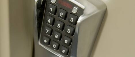 A numeric keypad lock on a door.