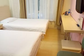 A hotel room with two beds, a desk, a chair, and a TV. - Hejia Inn (Beijing Fuwai Hospital) (Beijing)