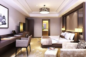 A hotel room with a bed, desk, chair, and a view of the cityscape. - Hebei Huibin Hotel (Shijiazhuang)