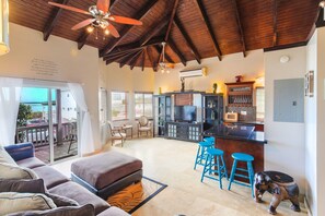 Family Villa, 3 Bedrooms | Living area | 56-inch Smart TV with cable channels, DVD player - Neptune Villas (Providenciales)