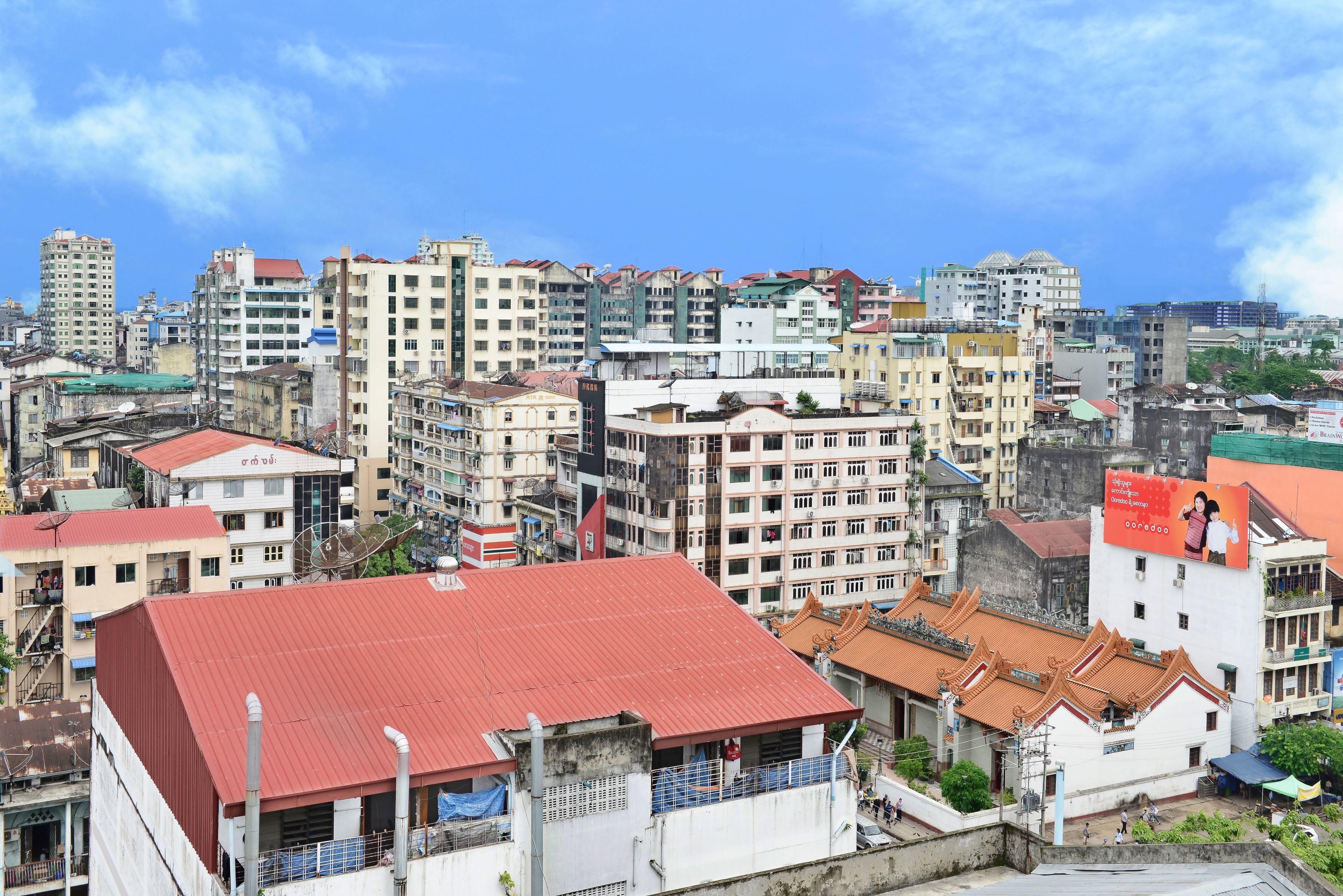 A densely packed urban area with various buildings, including multi-story residential and commercial structures.