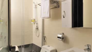 Shower, hair dryer, slippers, towels